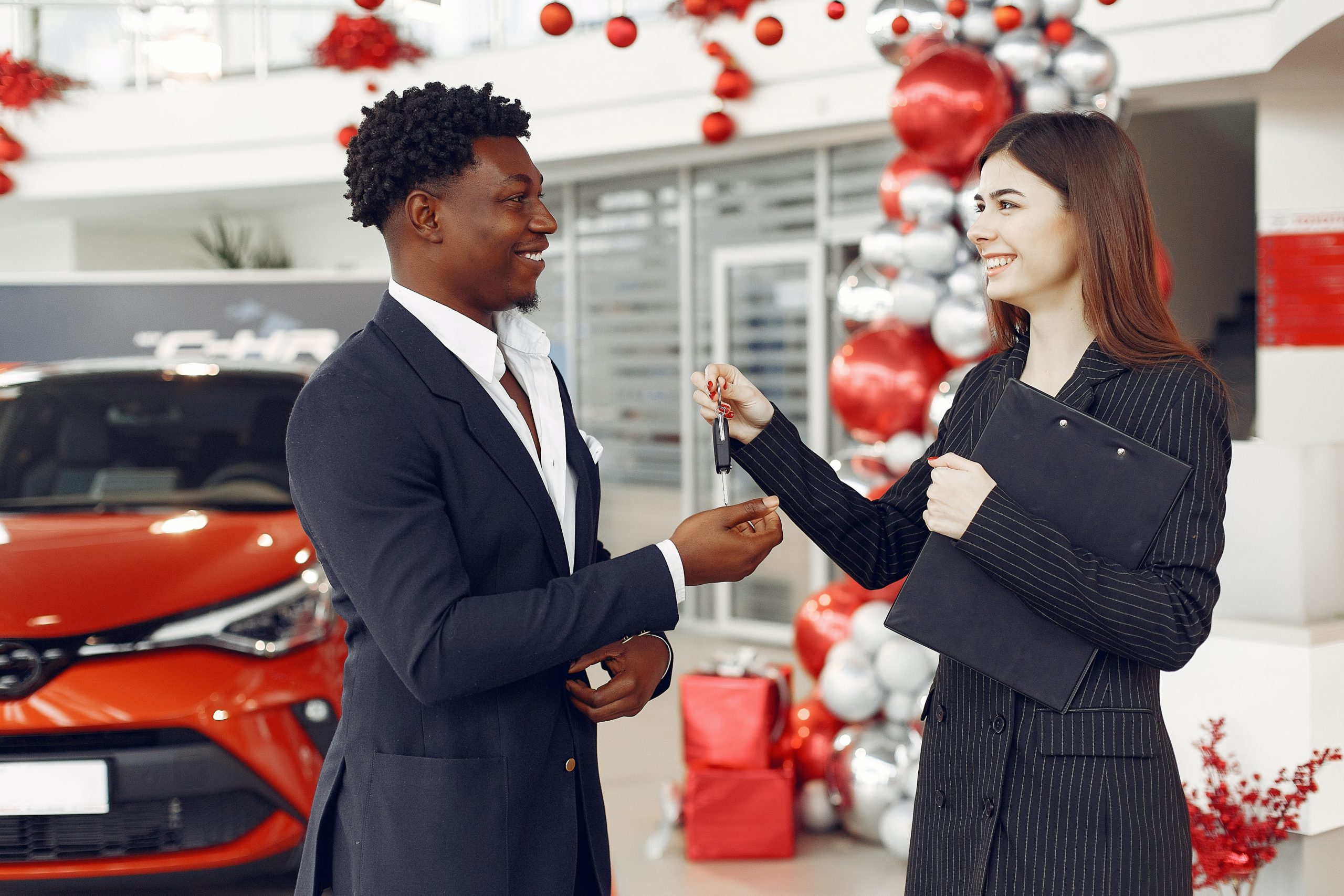 Car Saleswoman Handing over Car Keys