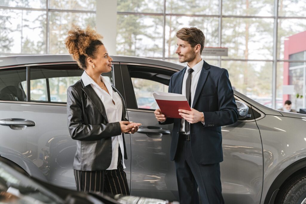 9 Challenges Affecting Car Dealerships And How Implementing CRM Software Can Help You In Overcoming Them 1 Car Sales Person